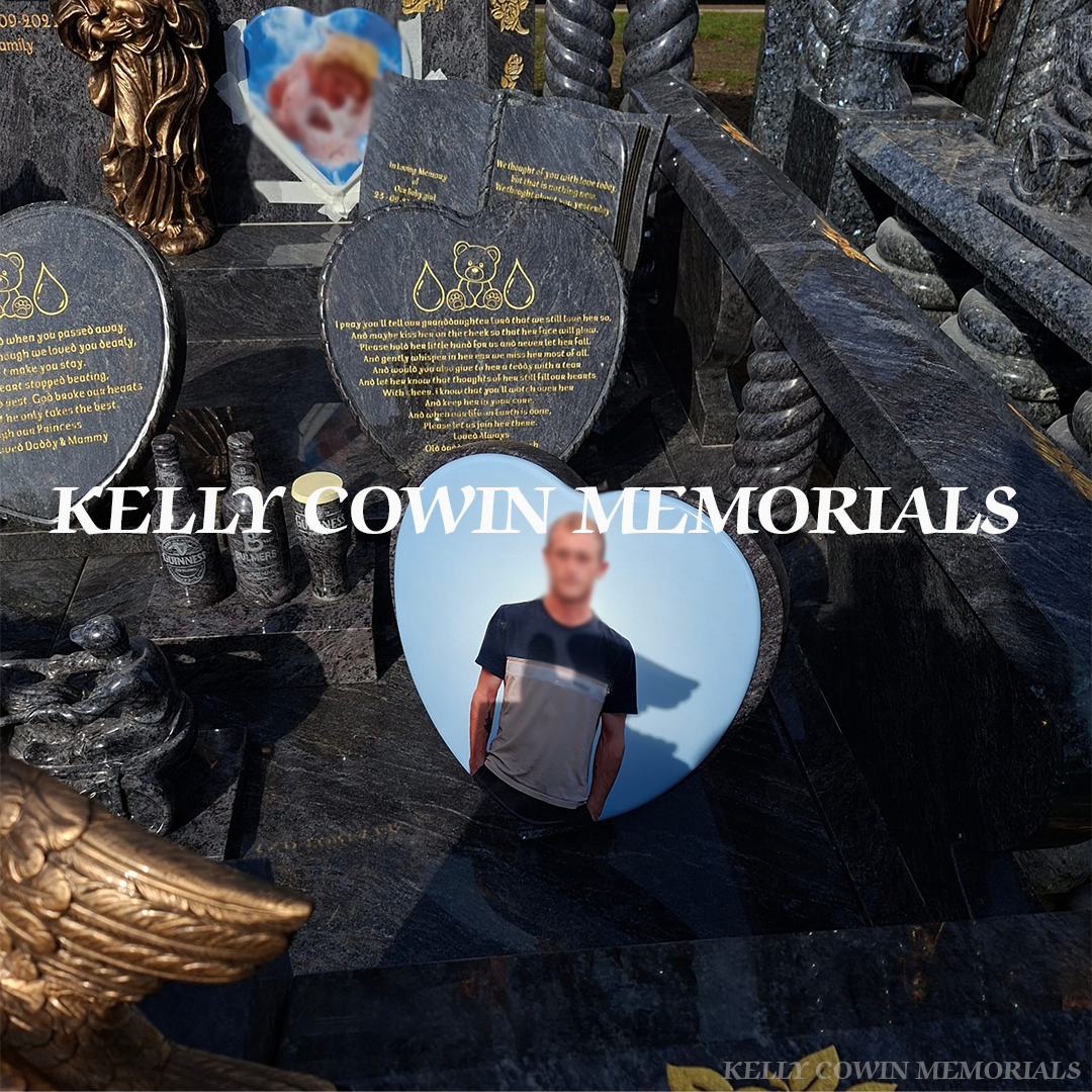 Close-up of gold leaf inscription and detailed statues on Blue Lagoon headstone