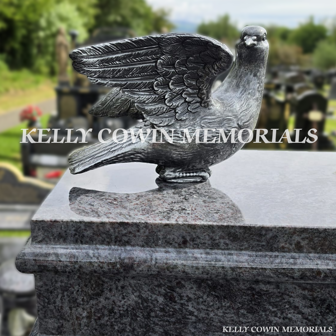 Close-up of large silver dove on Blue Lagoon headstone