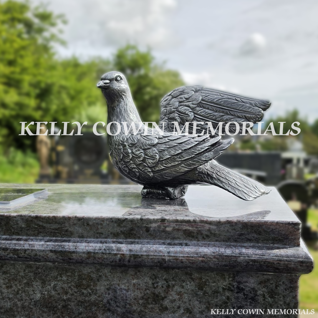 Close-up of large silver dove on Blue Lagoon headstone