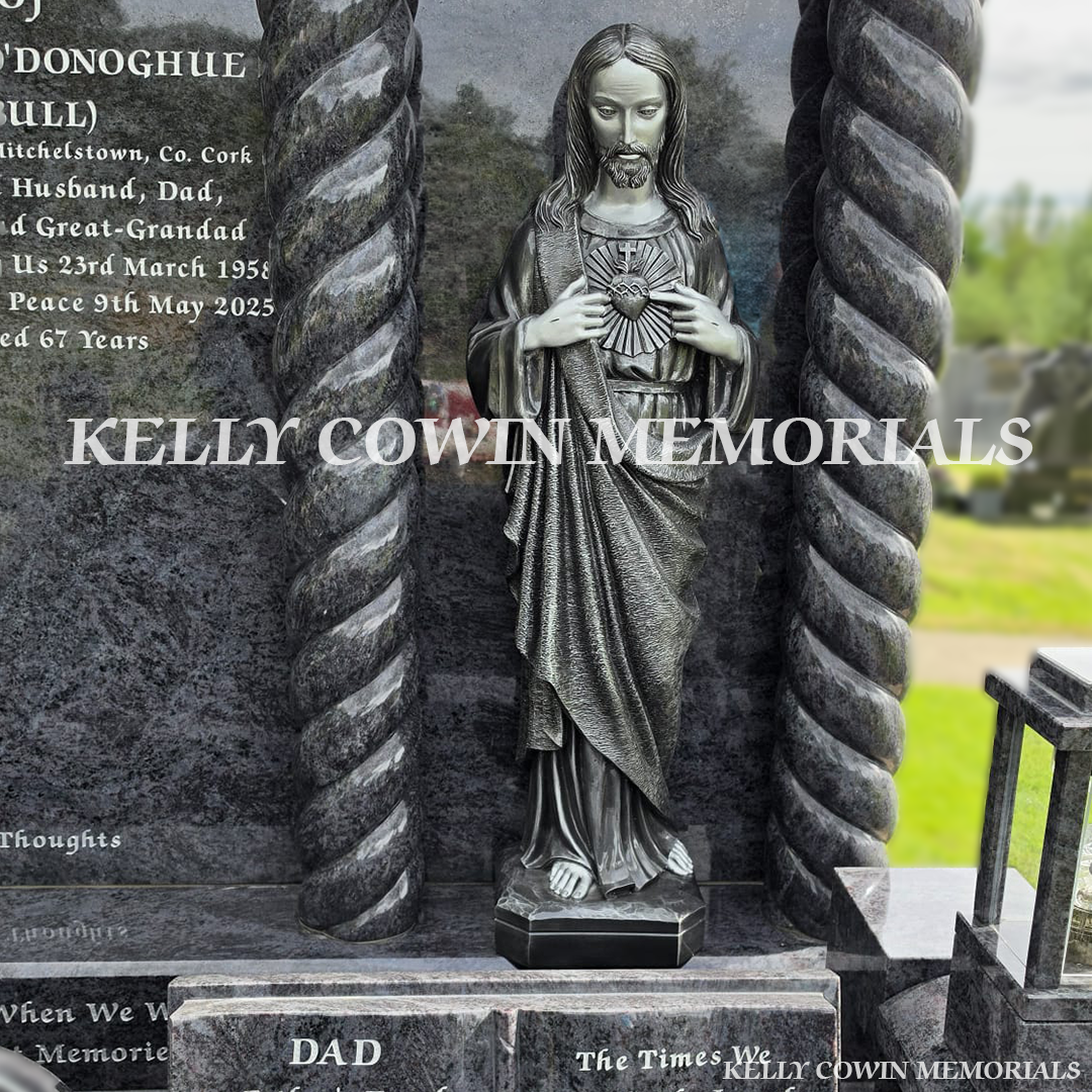 Close-up of large silver our lord statue on Blue Lagoon headstone