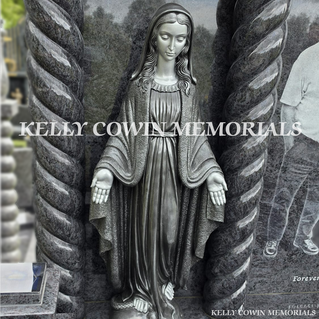 Close-up of large silver our lady statue on Blue Lagoon headstone
