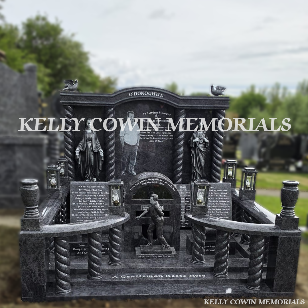 Front view of Blue Lagoon custom memorial with twisted pillars and silver statues in Cork cemetery