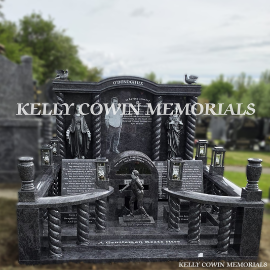 Front view of Blue Lagoon custom memorial with twisted pillars and silver statues in Cork cemetery