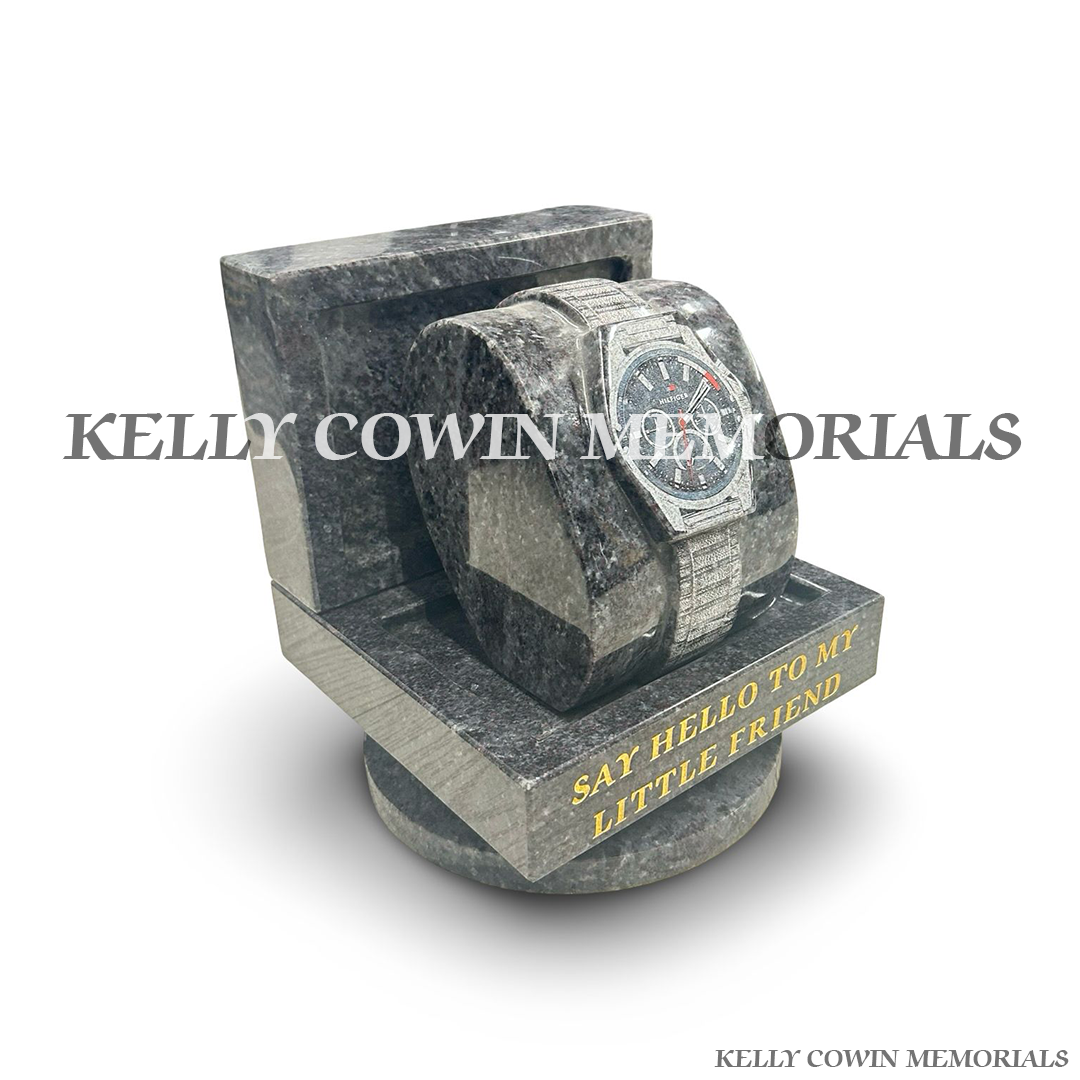 side view of Blue Lagoon granite memorial watch ornament featuring a detailed Tommy Hilfiger style laser engraved watch image with 23.5-carat gold inscription, handcrafted by Kelly Cowin Memorials for personalised memorials across Dublin and Ireland.
