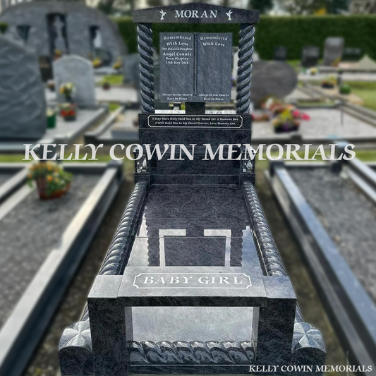 Front view of Blue Lagoon book headstone with cap and twisted pillars in Wexford Cemetery