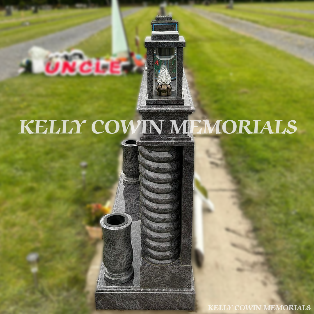 Side view of Blue Lagoon memorial with twisted pillars and lanterns