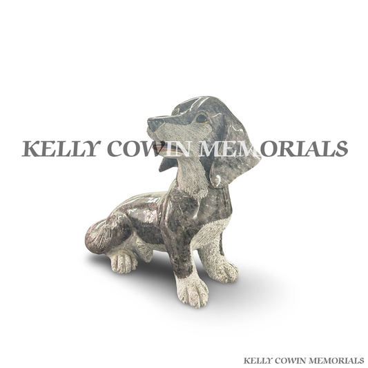Side view of polished Blue Lagoon granite dachshund dog ornament
