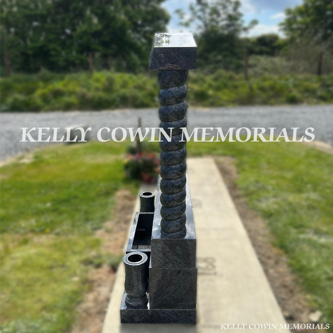 Side view of Blue Lagoon memorial with twisted pillars and tall vases