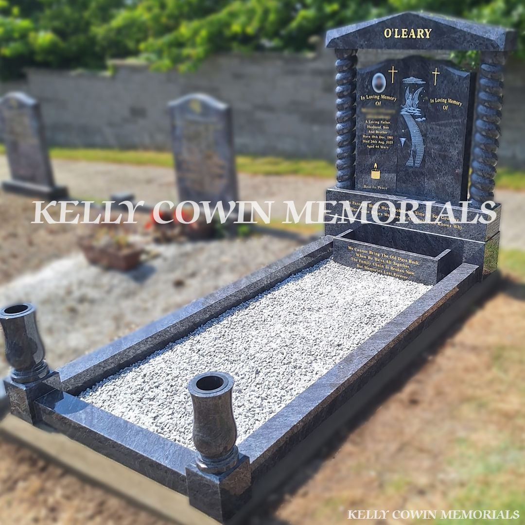 Side view of Blue Lagoon memorial with kerbing, vases and flower box