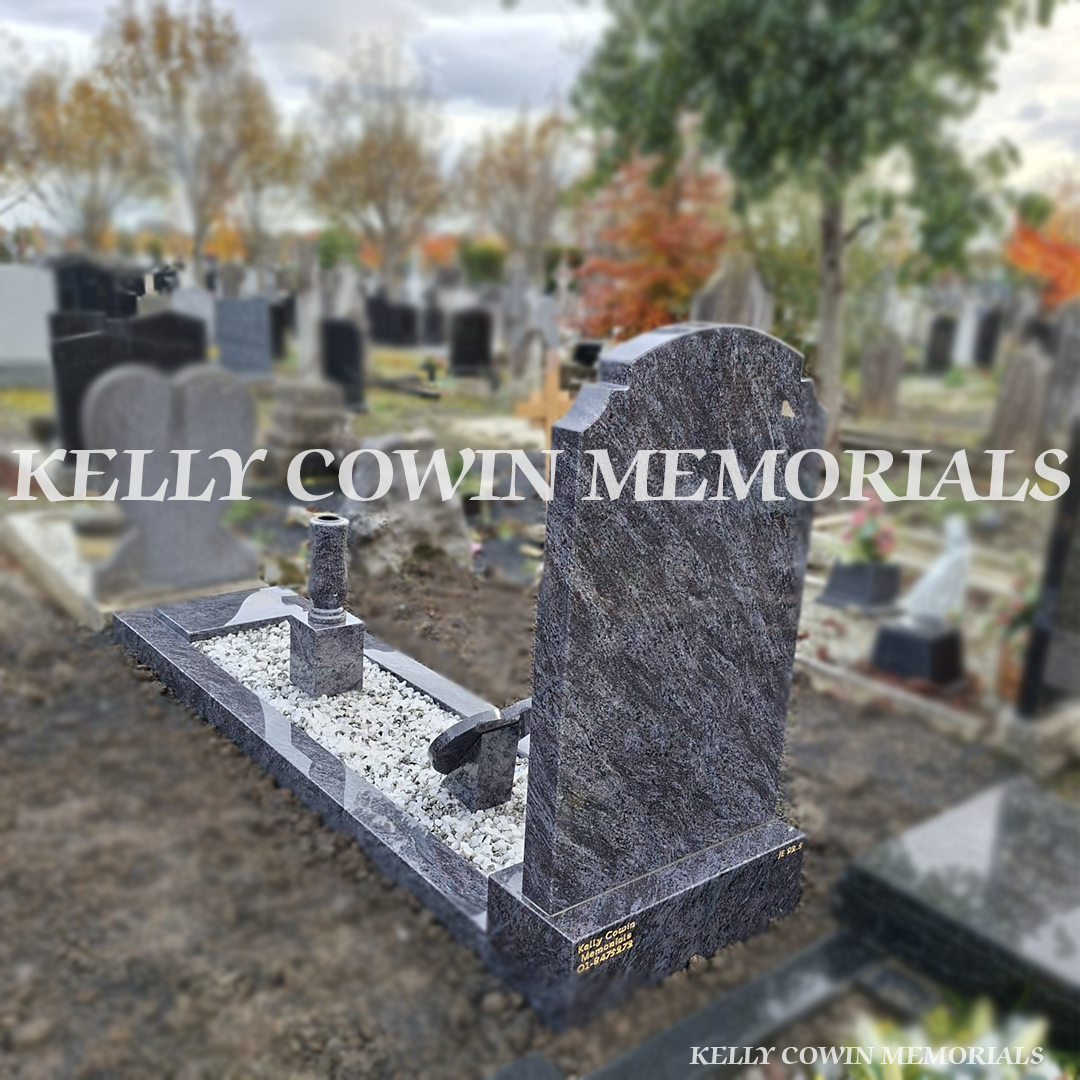 Rear view of Blue Lagoon Granite “Top Nine” memorial showing full kerbing and white Moldovan chippings — installed by Kelly Cowin Memorials for graves and memorials in Dublin, Glasnevin, Balgriffin, Fingal, and Dardistown.