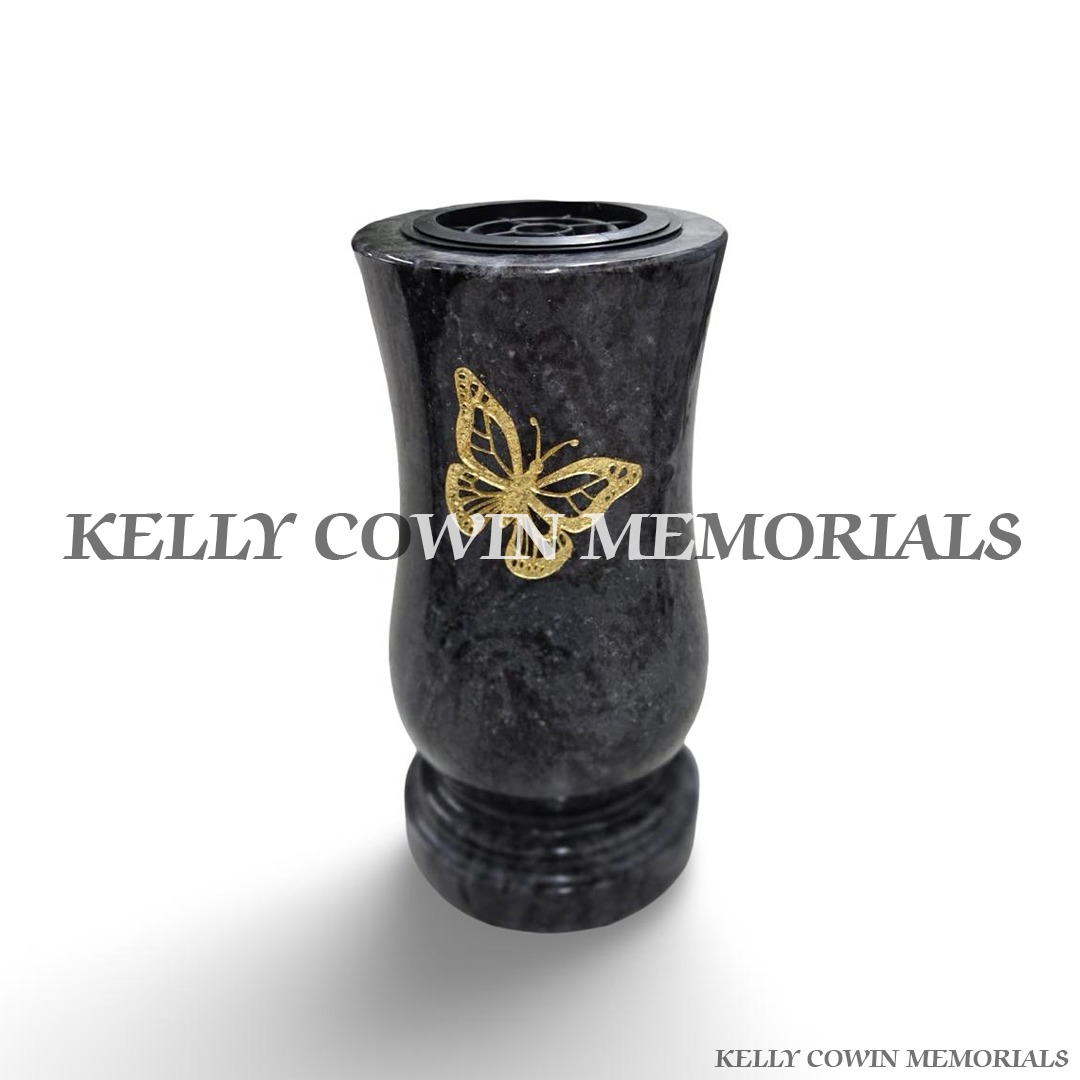 Large Blue Lagoon polished granite grave vase with natural blue-grey stone patterns, gold engraved butterfly design, curved shape, matching granite base and removable flower holder by Kelly Cowin Memorials Ireland.
