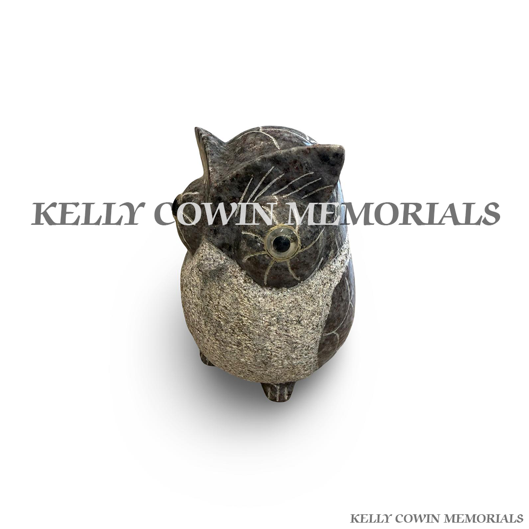 Side view of polished Blue Lagoon granite owl ornament