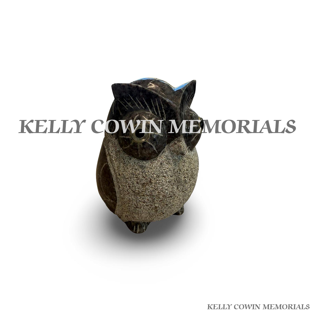 Close-up of carved owl detail on Blue Lagoon granite memorial accessory