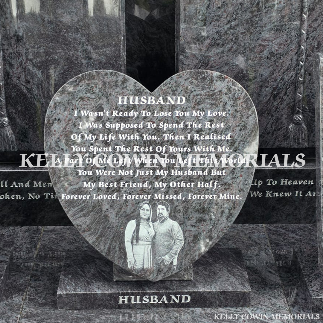 Blue Lagoon granite heart memorial on polished plinth with personalised silver engraved tribute and custom laser-etched couple photograph.