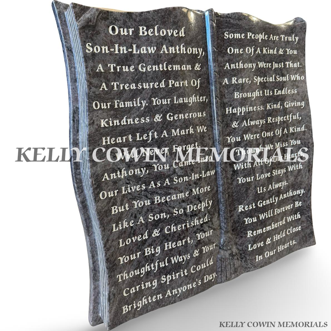 Custom Blue Lagoon granite open book grave memorial with silver lettering across both pages.