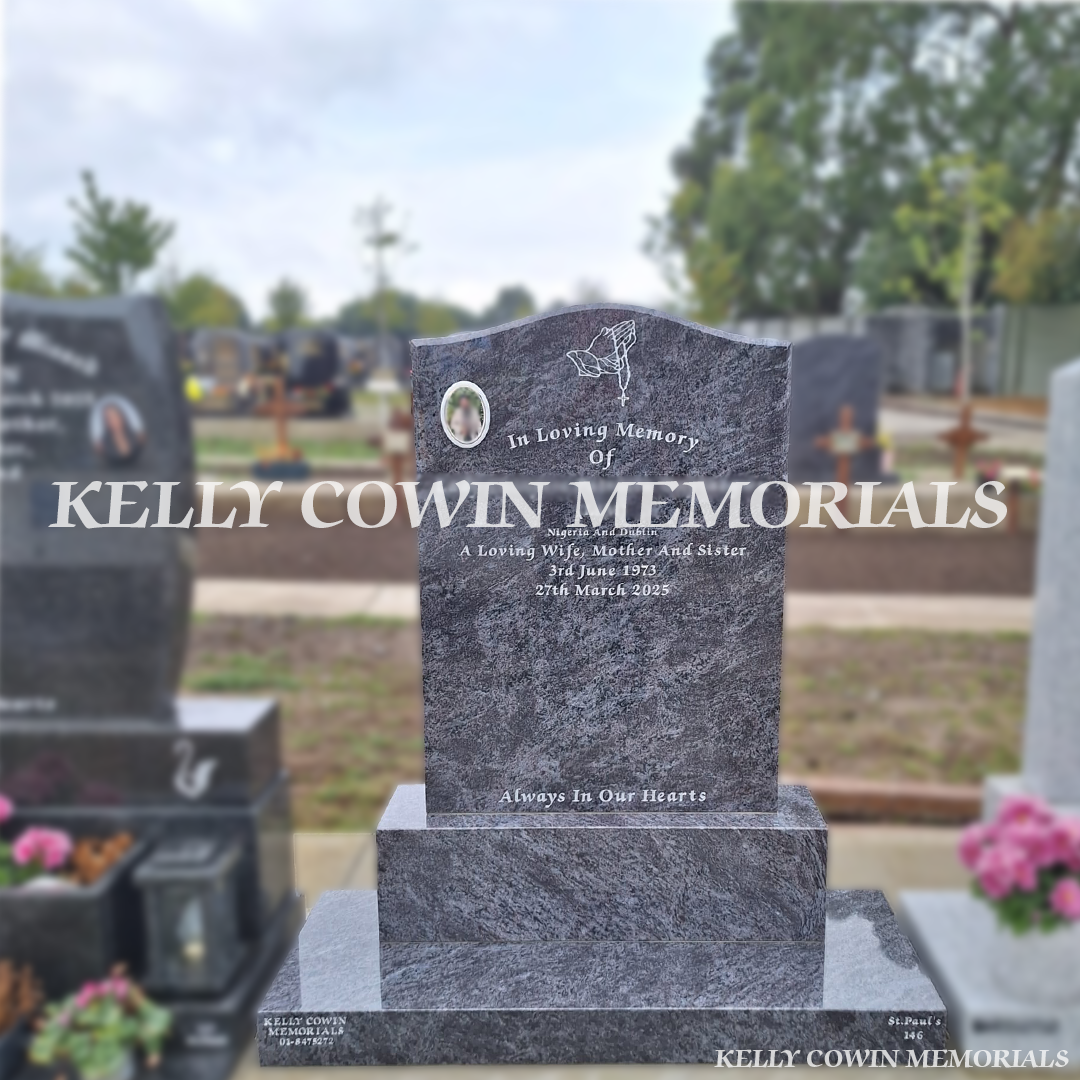 Blue Lagoon OG granite headstone with silver inscription, oval ceramic photograph, praying hands engraving, base and plinth in Balgriffin Cemetery Dublin.