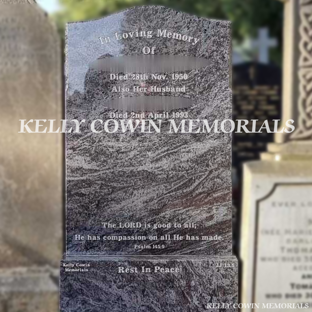 Gravestone with engraved text in a cemetery, 