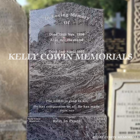 Gravestone with engraved text in a cemetery, 