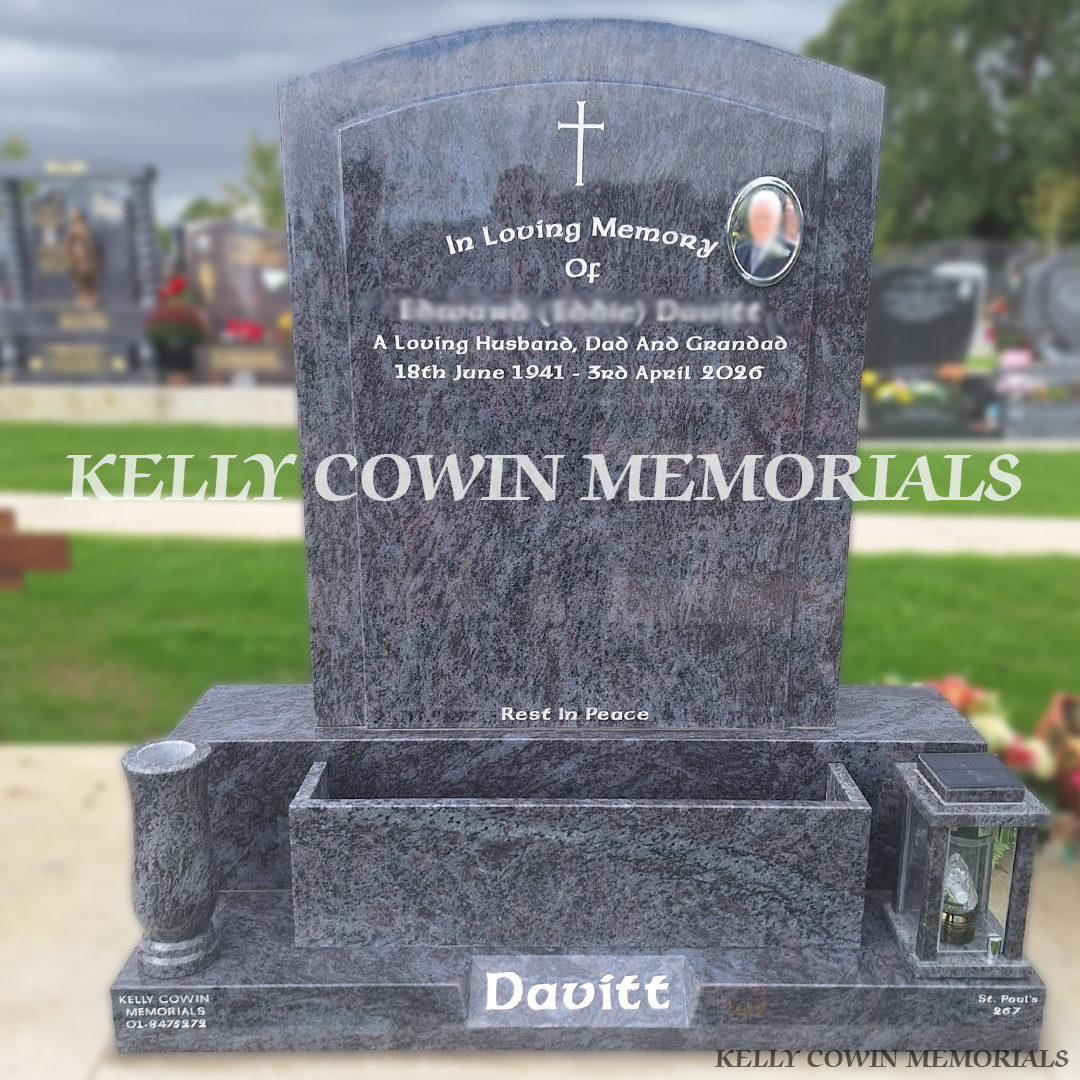 Blue Lagoon polished boulder granite headstone in Balgriffin Cemetery Dublin with silver inscription, ceramic photo, flowerbox, vase and solar lantern.