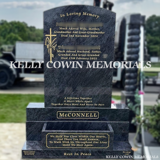 Front view of Blue Lagoon polished boulder headstone with gold inscription and flower box in Balgriffin Cemetery Dublin