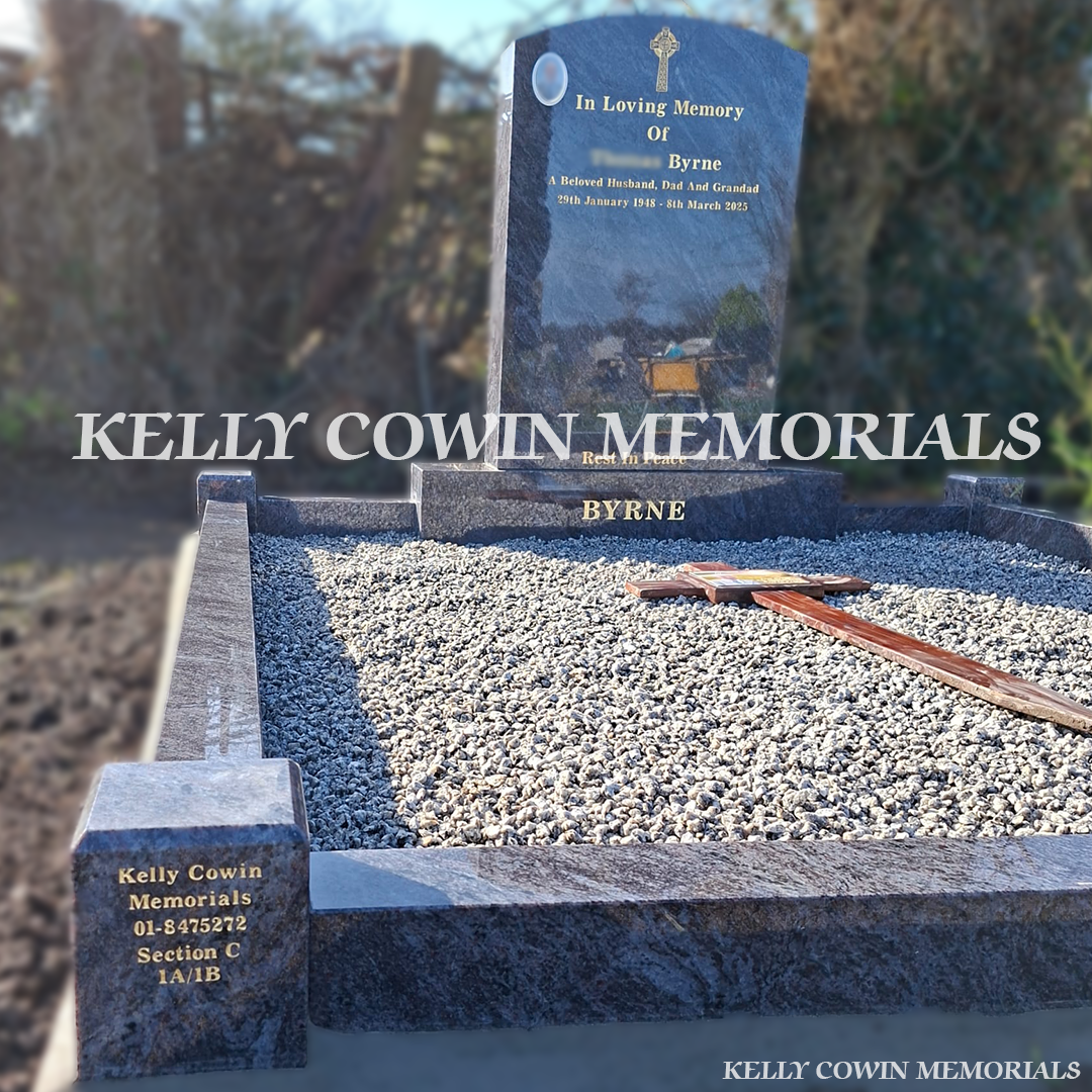 Front  low view of Blue Lagoon polished boulder headstone with gold inscription in Balscadden Cemetery
