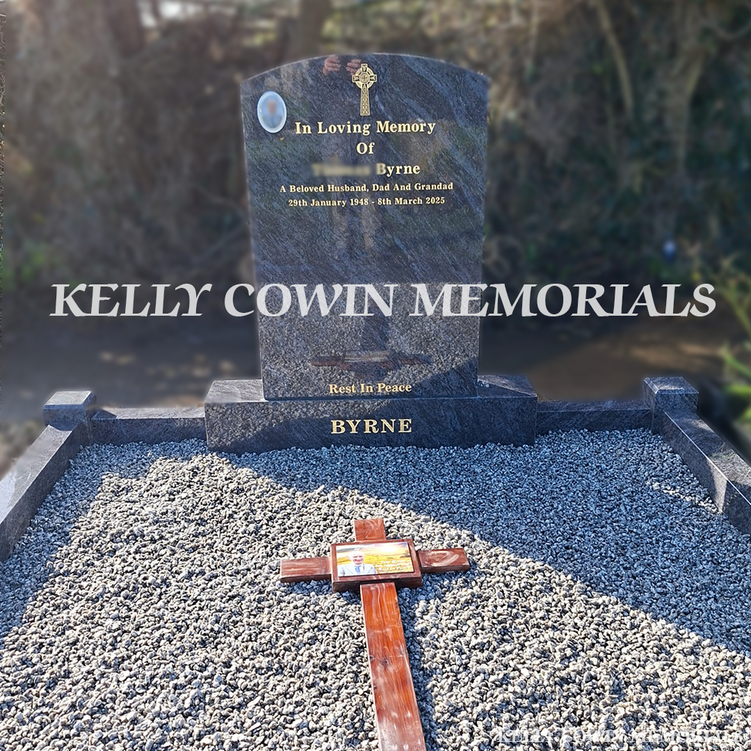 Front view close up of Blue Lagoon polished boulder headstone with gold inscription in Balscadden Cemetery