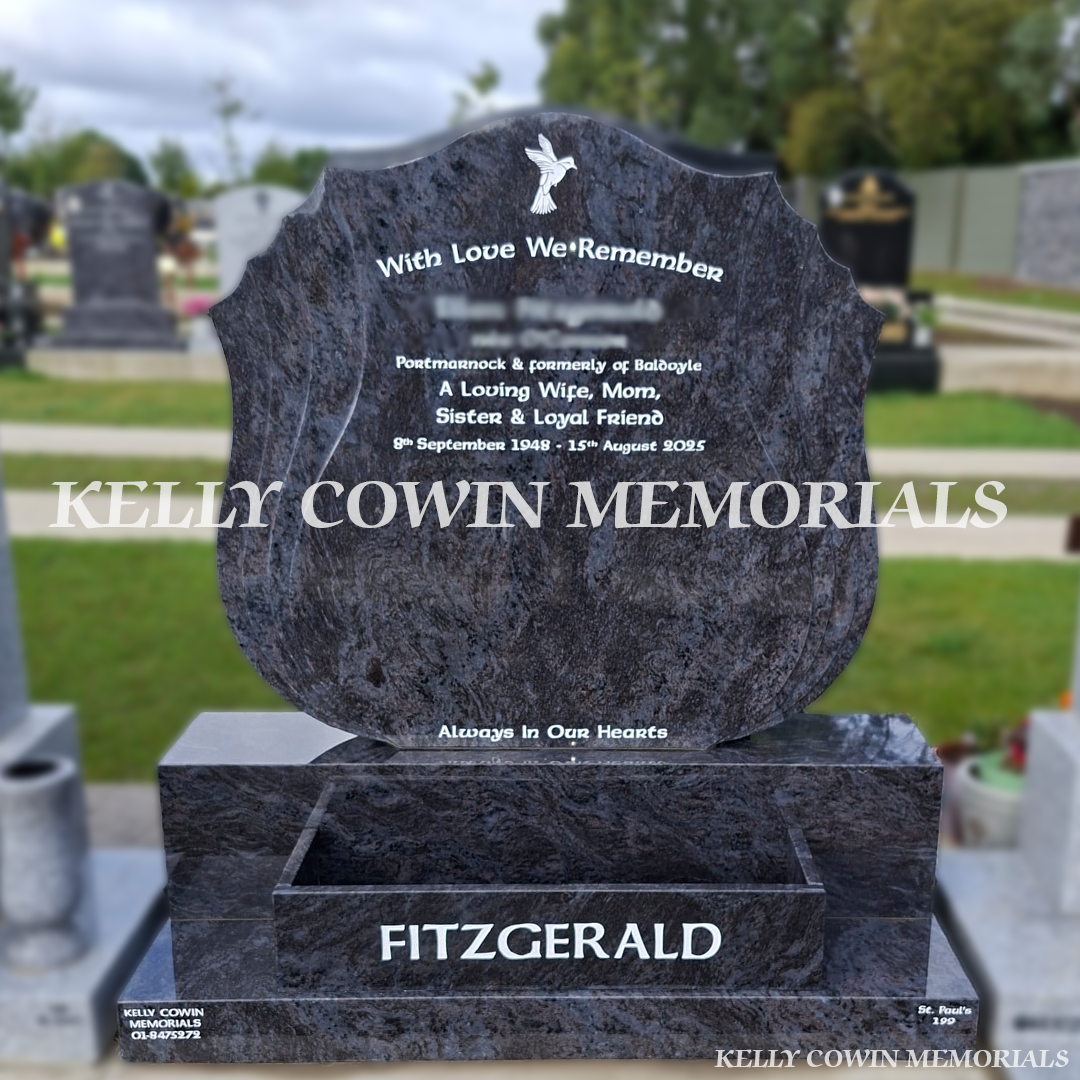 Blue Lagoon granite shell headstone with white inscription, dove engraving and flowerbox in Balgriffin Cemetery Dublin.