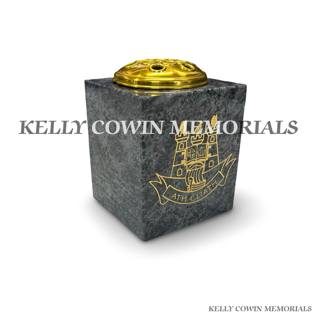 Side view of polished Blue Lagoon granite vase with gold crest engraving