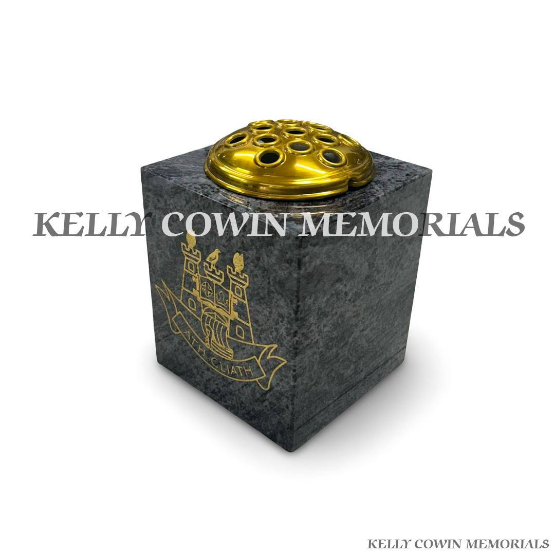 Side view of polished Blue Lagoon granite vase with gold crest engraving