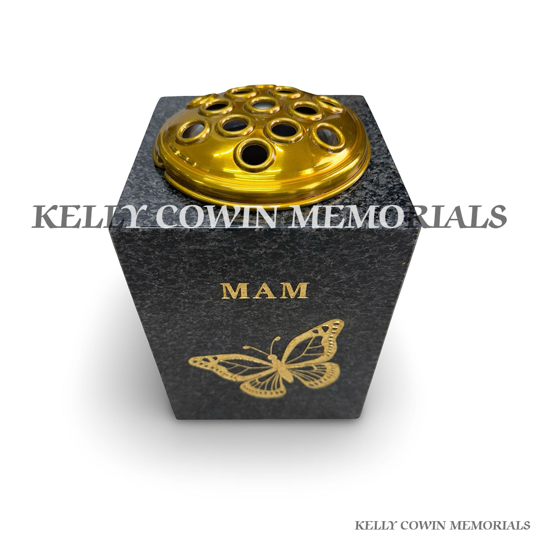Close-up of gold Mam inscription and butterfly engraving on Blue Lagoon vase