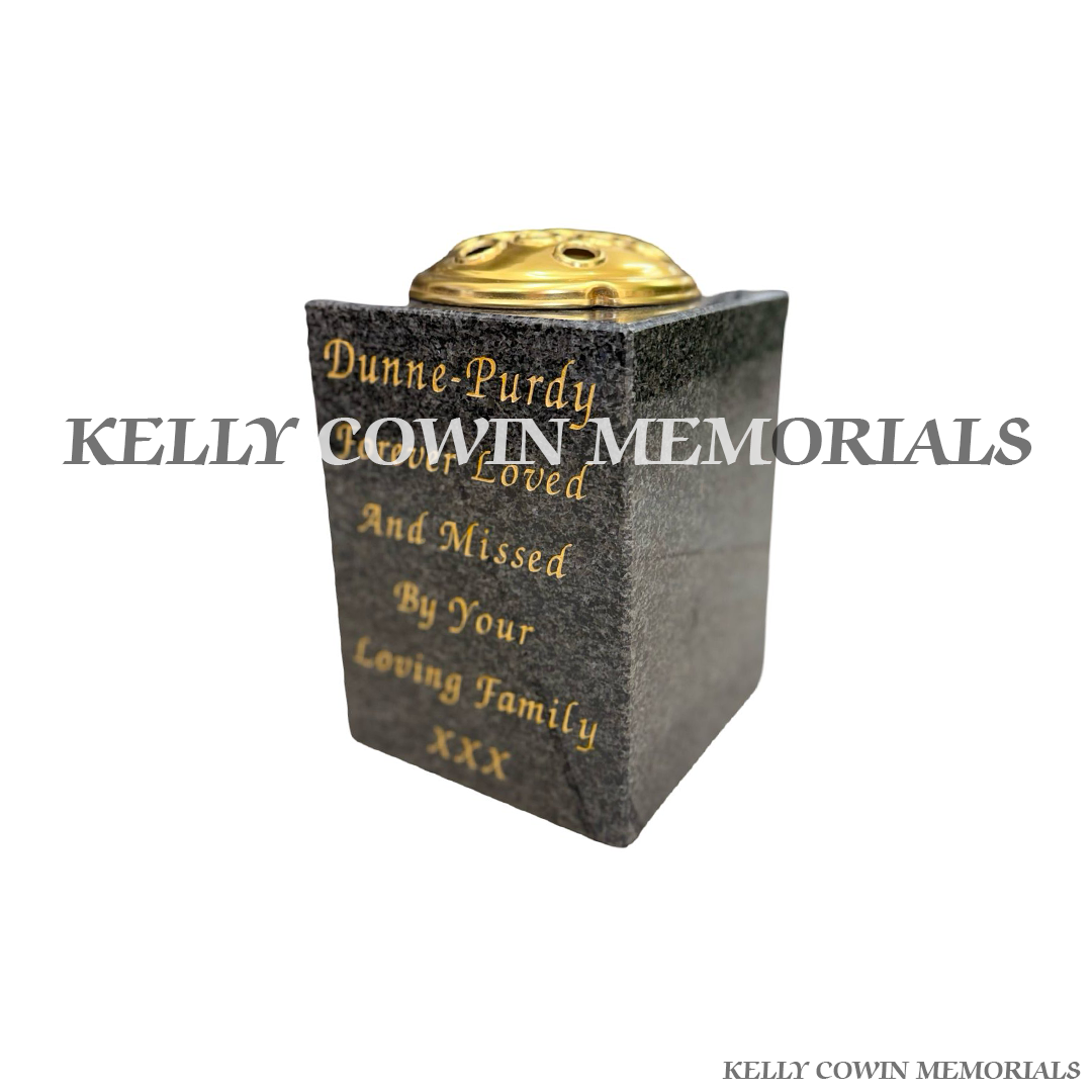 Side view of polished Blue Lagoon granite square vase with gold lid