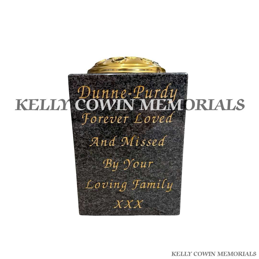 Front view of Blue Lagoon square vase with gold lid and gold inscription
