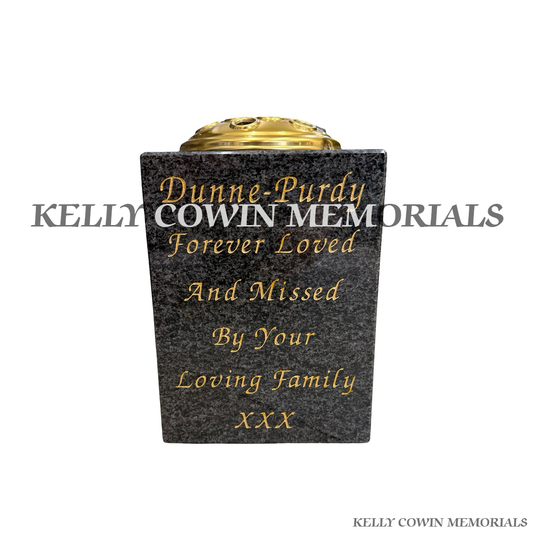 Front view of Blue Lagoon square vase with gold lid and gold inscription