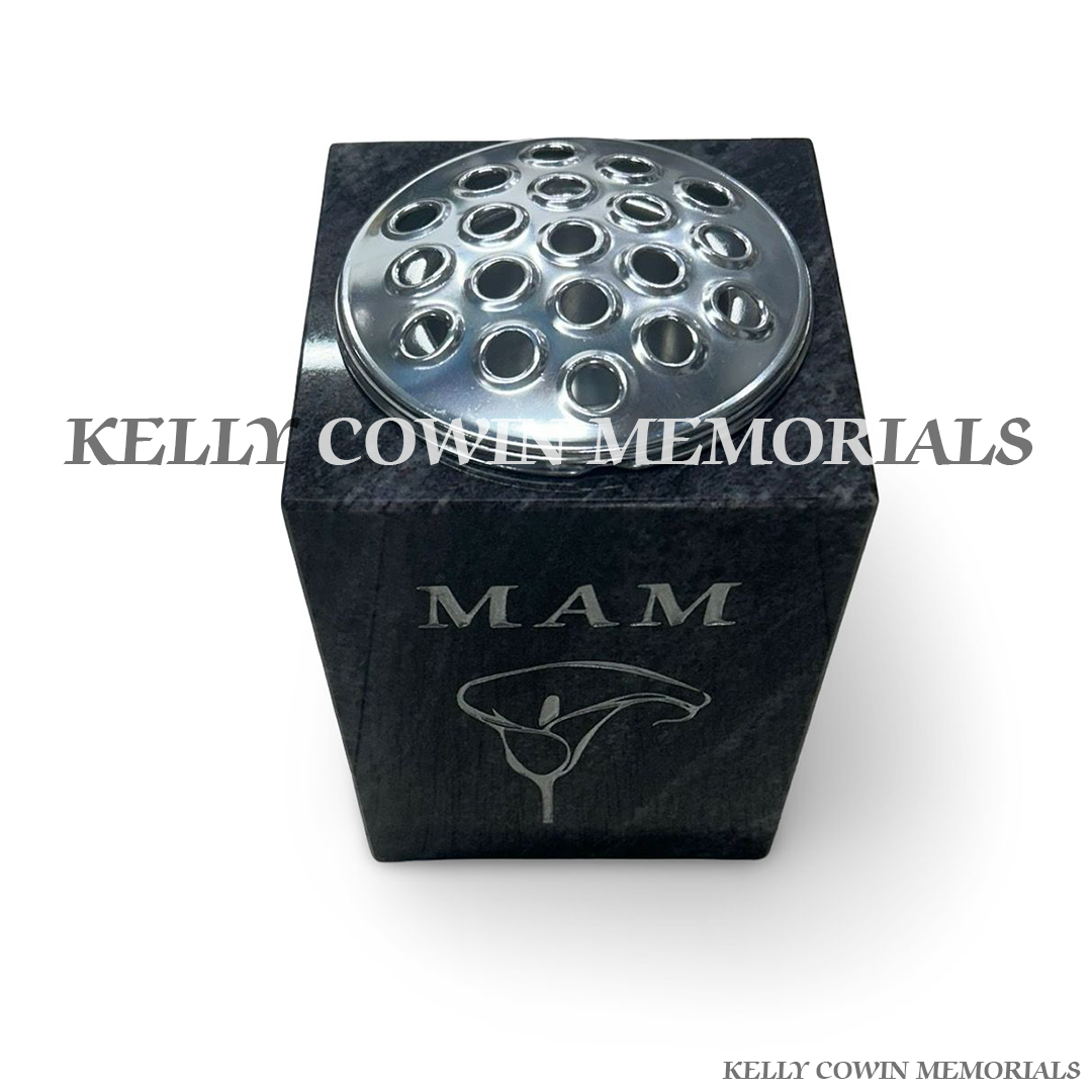 Front view of Blue Lagoon square vase with silver lid and silver inscription