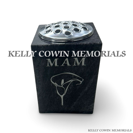 Front view of Blue Lagoon square vase with silver lid and silver inscription