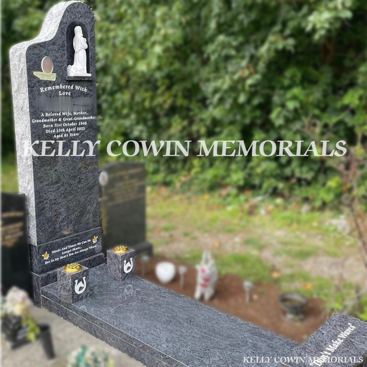Side view of Blue Lagoon Tall Grotto memorial showing rough edges, slab, and bench in Glasnevin Cemetery