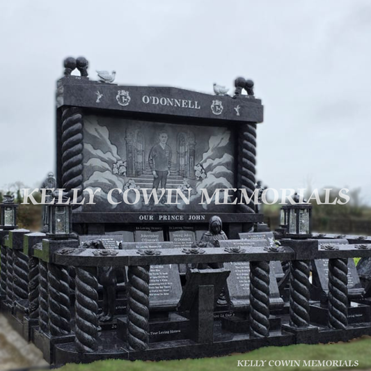 Angled view of Blue Lagoon Traveller memorial with laser artwork, pillars and kerb set in Limerick – Kelly Cowin Memorials