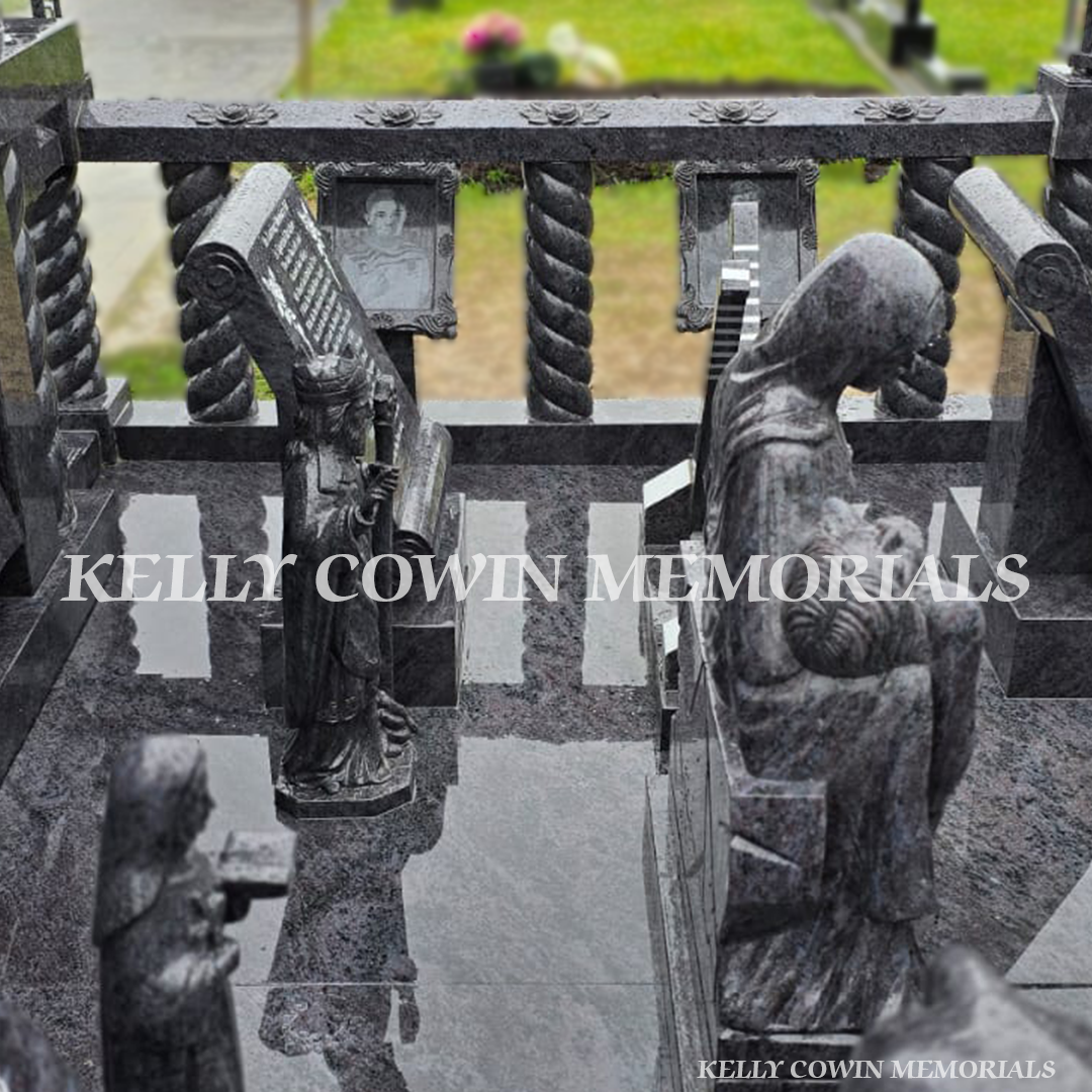 Close-up of granite statues and carved detailing on custom Traveller memorial in Limerick – Kelly Cowin Memorials