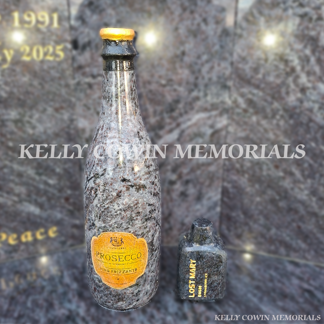 Blue lagoon vape and bottle of prosecco installed in balgriffin cemetery, kelly cowin memorials