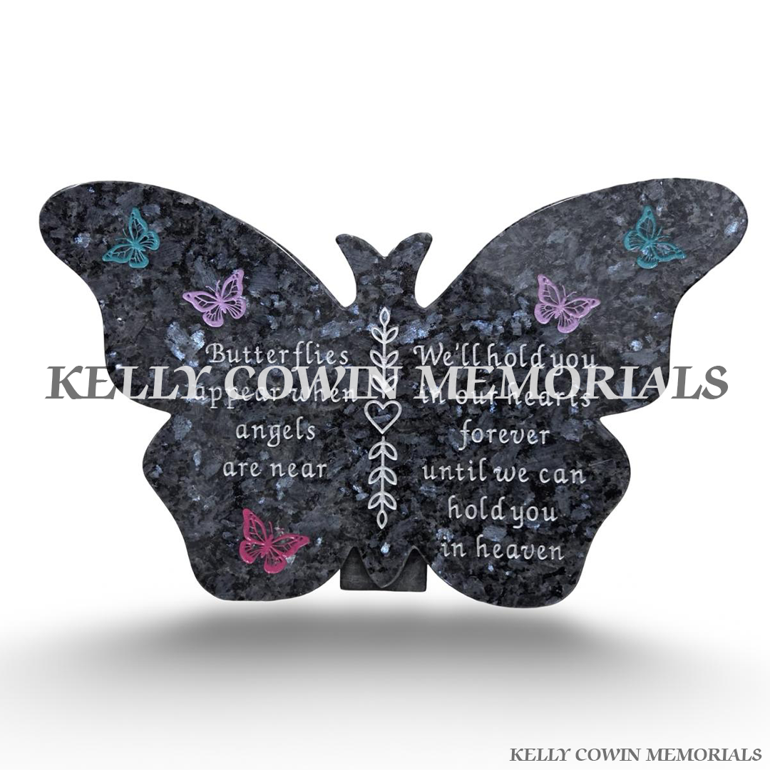 Blue Pearl granite butterfly-shaped memorial plaque featuring colourful pink, purple and turquoise butterfly engravings, delicate silver floral detailing and personalised memorial inscription by Kelly Cowin Memorials Ireland.