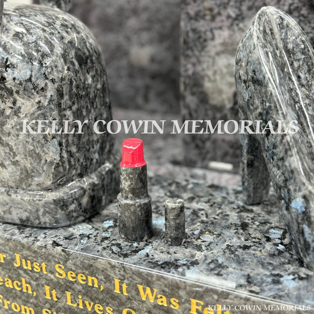 Close-up of lipstick on Blue Pearl granite plinth