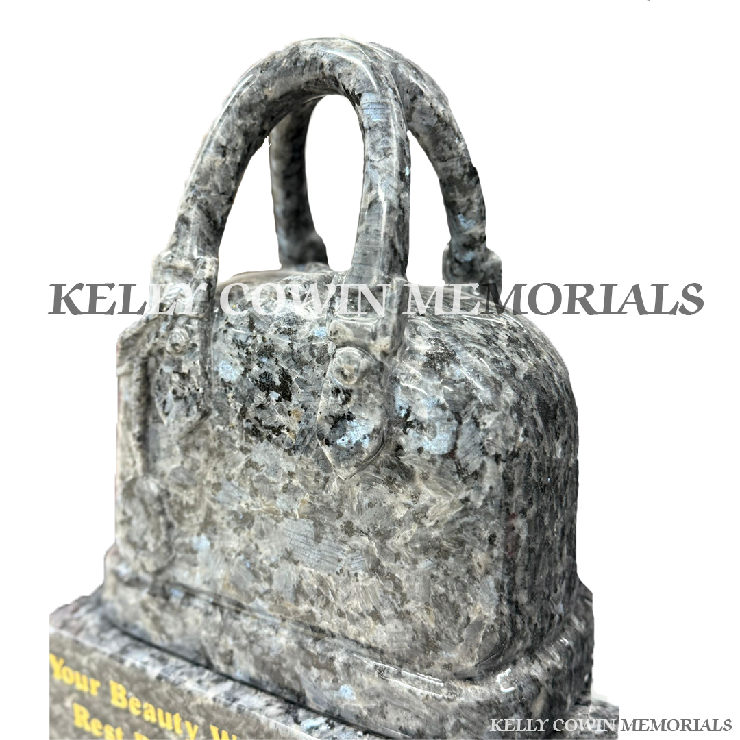 Close-up of blue pearl handbag on Blue Pearl granite plinth