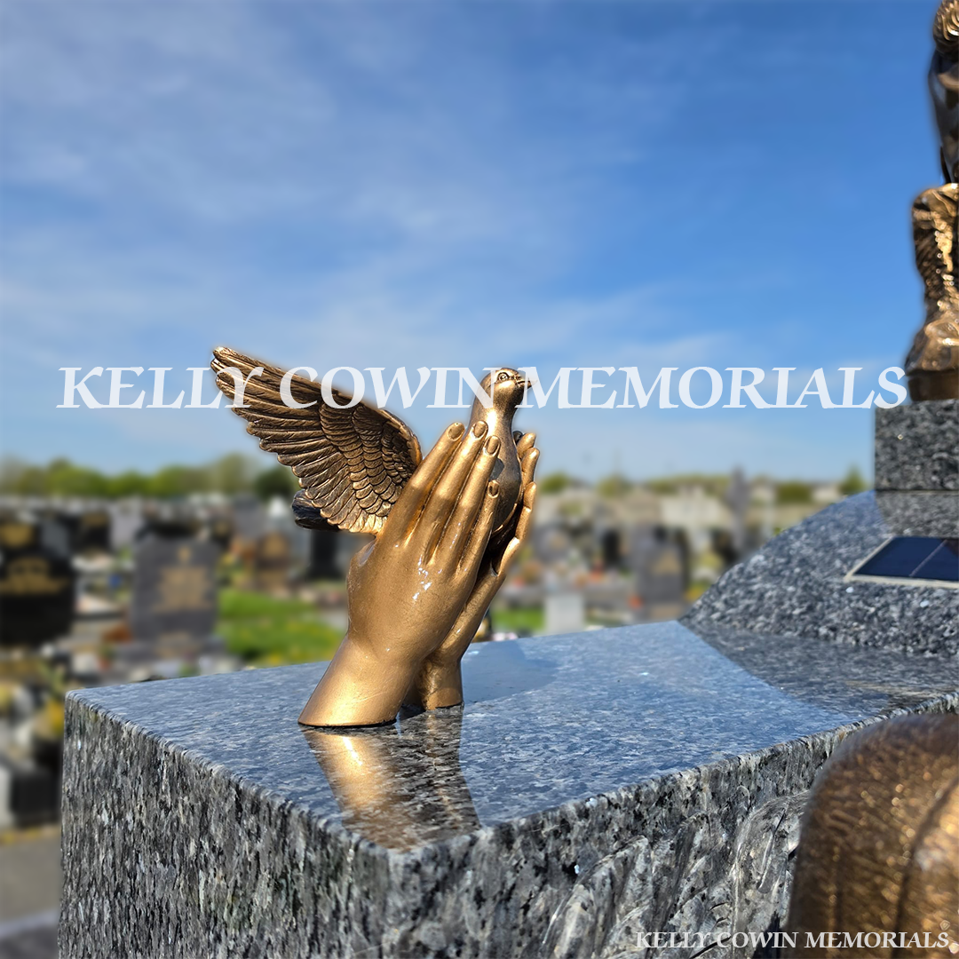 Close-up of bronze dove in hand on Blue Pearl Cap