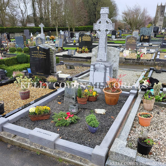 after celtic cross grave renovation with cleaned headstone and new stone chippings in Dublin Ireland