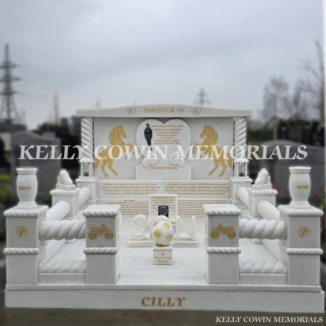 Crystal White marble custom children’s headstone with heart design, gold leaf engraving and full kerbing in Mulhuddart Cemetery Dublin