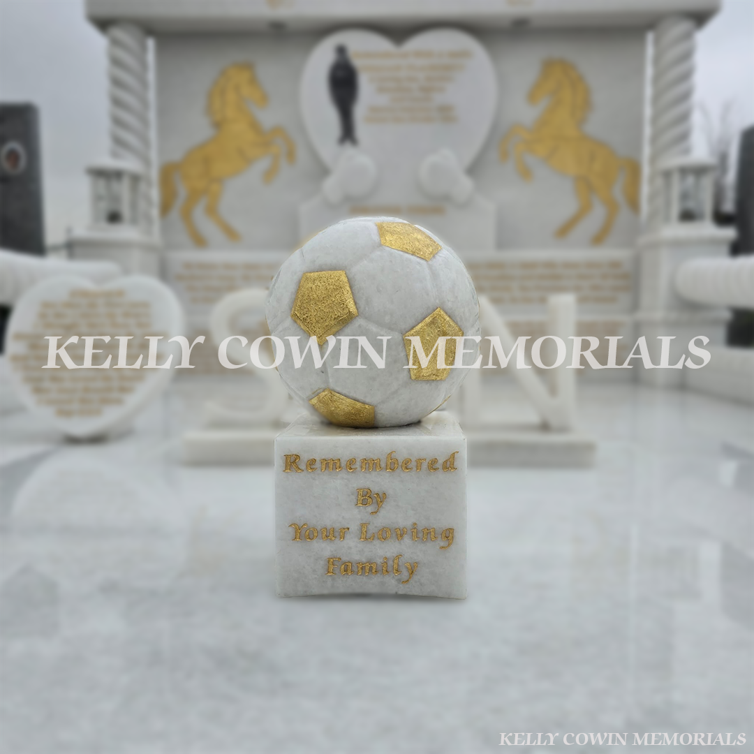 Crystal White marble football memorial with gold leaf detail on children’s headstone in Mulhuddart Cemetery Dublin