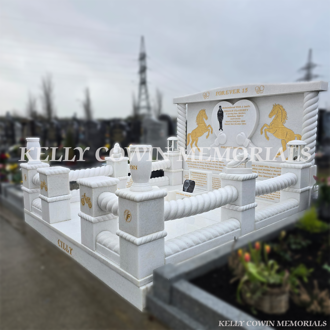 Side view of a Crystal White marble children’s headstone with twisted boxing ring style kerbing in Mulhuddart Cemetery Dublin