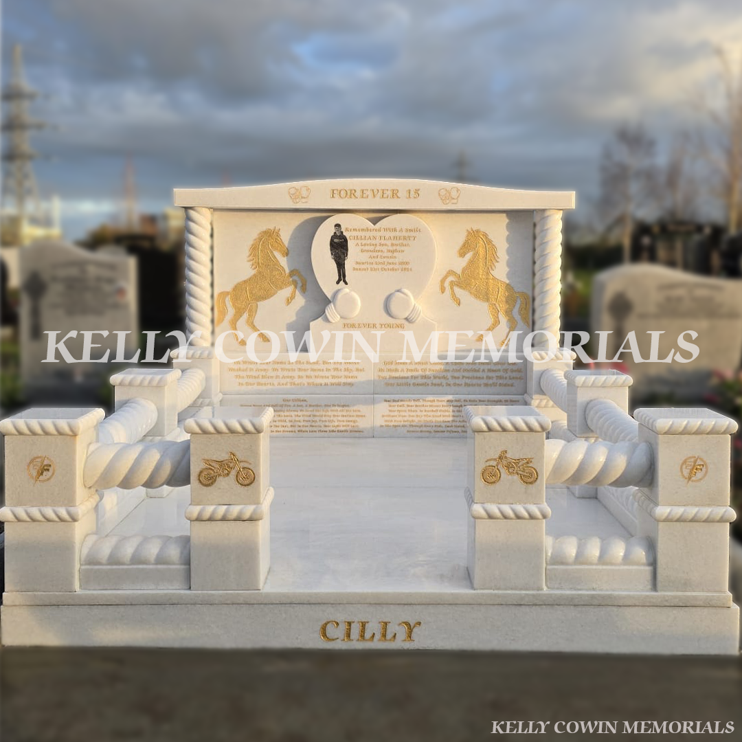 Full view of a Crystal White marble custom heart headstone with twisted rail kerbing and gold leaf engraving in Mulhuddart Cemetery Dublin