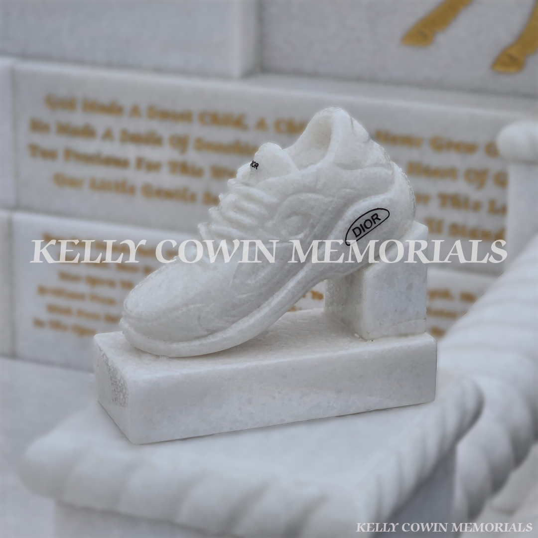 Crystal White marble custom children’s headstone detail showing Dior runners and engraved accessories in Mulhuddart Cemetery Dublin