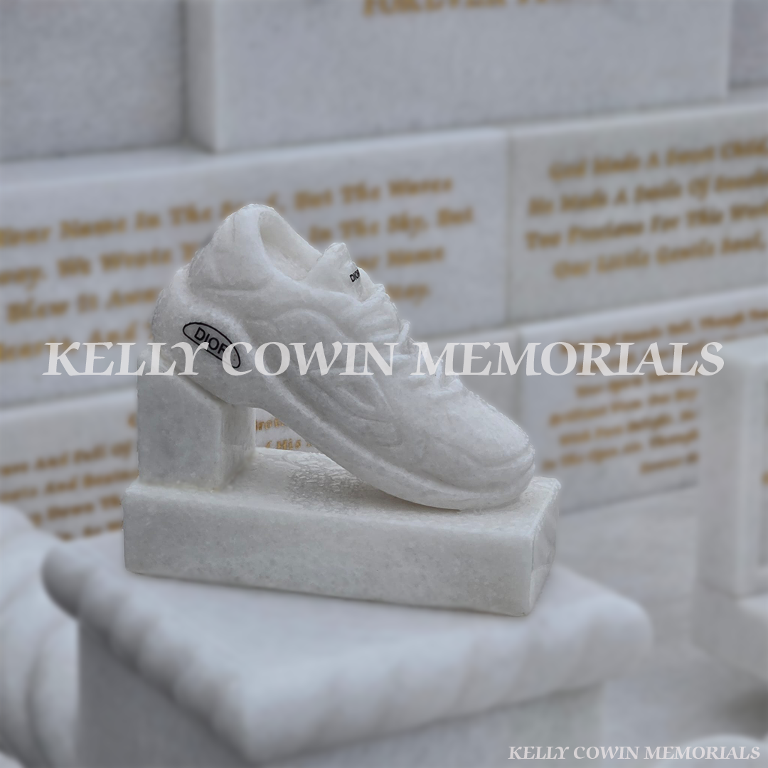 Crystal White marble custom children’s headstone detail showing Dior runners and engraved accessories in Mulhuddart Cemetery Dublin
